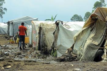 A man carries water in a camp for displaced people in Goma, in eastern Democratic Republic of the Congo.