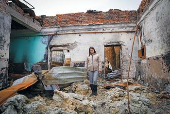 A woman stands in a bombed-out building in Pokrovsk Town in the Donetsk region of Ukraine.