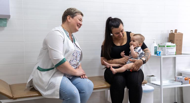 An eight-month-old baby waits to be vaccinated at a health centre in Kyiv's Shevchenkivskyi district.