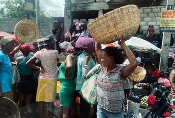 People shop at a market in the Haitian capital, Port-au-Prince.