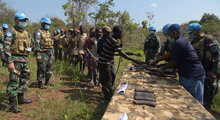 Militiamen men in the eastern DR Congo surrender their weapons to UN peacekeepers.