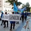 Protesters in Washington, DC, march against the alleged killing of Uyghur Muslims.