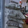 An armed police officer (left) patrols outside a classroom of first graders where the windows have been covered with sandbags, at a school in Marinka, Donetsk Oblast, Ukraine.