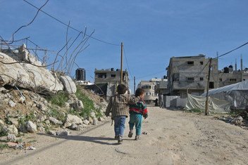 Two children walk on road in Gaza. (file photo)