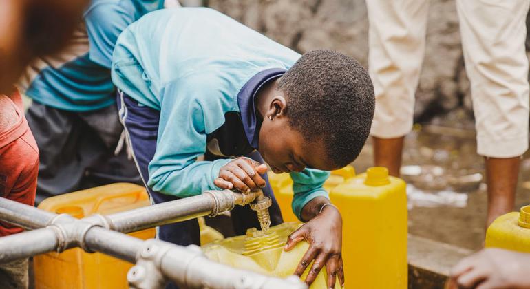 A child fills a container at a water tap installed by UNICEF in Kanyaruchinya near Goma, in the eastern DR Congo.