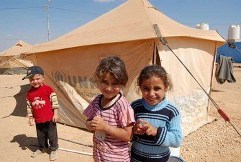 Syrian children outside their UNHCR tent at Jordan’s Za’atri refugee camp.