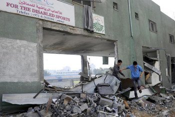 Young boys playing in the rubble of the Palestine Stadium in Gaza City which was the target of Israeli airstrikes.