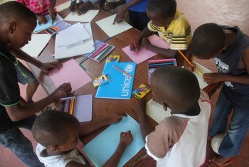 Children at a temporary shelter in Bujumbura, Burundi, use drawing to help them forget the turmoil they have gone through.